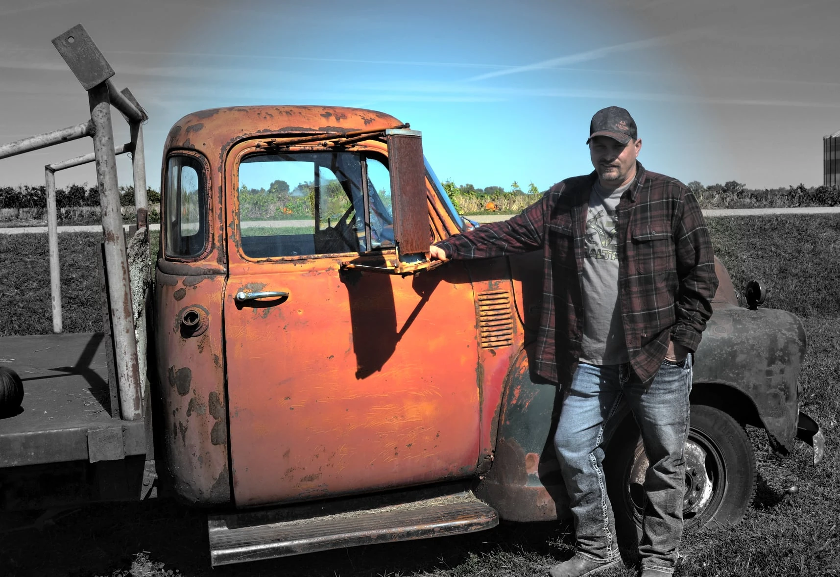 Jason Sickles, Csyfer, standing beside a vintage work truck